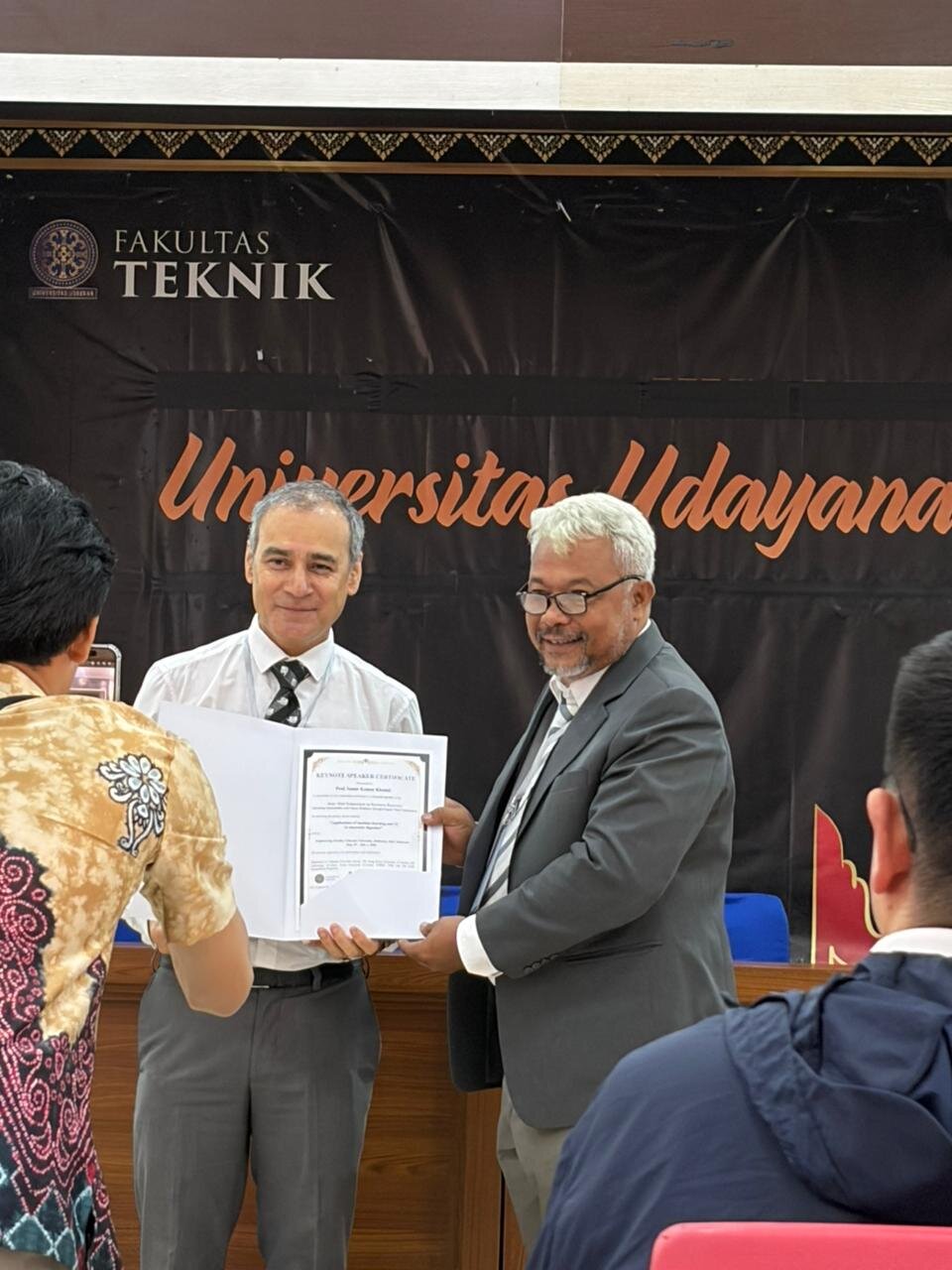 Prof. Khanal receiving a Keynote Speaker Certificate at Universitas Udayana, Fakultas Teknik